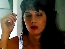 Girl In A White Corset Smokes Cigarette