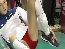 Pro Sport Girl Stretches On The Floor