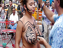 Stunning Bare-Chested Woman Getting Painted